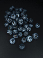 Blueberry berries on a dark background