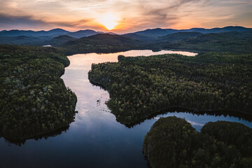Aerial view of beautiful mountain lake at sunset in Maine Woods