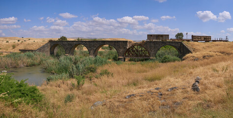 The remains of railroad bridge that was built in 1904 over Jordan river with the laying of the...