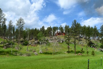 A red cabin in the woods of South Dakota