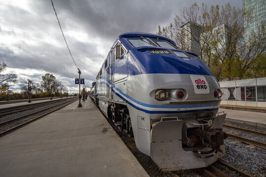 MONTREAL, CANADA - NOVEMBER 7, 2018: Allo Exo Montreal suburban train with its logo on a locomotive ready for departure in commuter train station of Gare Lucien L'Allier in Downtown Montreal, Quebec