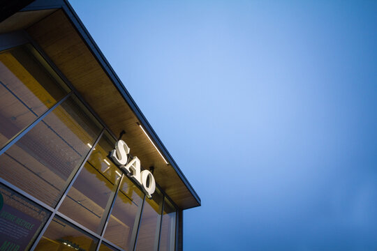 MONTREAL, CANADA - NOVEMBER 9, 2018: SAQ logo on their main shop for Montreal center. Also known as Societe des Alcools du Quebec, it sells spirits, alcool, wine and beer.