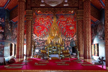 The golden sitting Buddha is main in a Church at Wat Phra That Choeng Chum Worawihan It is an important sacred place of the house. City partner since ancient times.