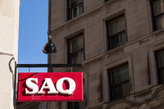 MONTREAL, CANADA - NOVEMBER 4, 2018: SAQ logo on their main shop for Montreal center. Also known as Societe des Alcools du Quebec, it sells spirits, alcool, wine and beer