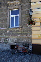 Fototapeta na wymiar Bicycle stands on the street in a big city