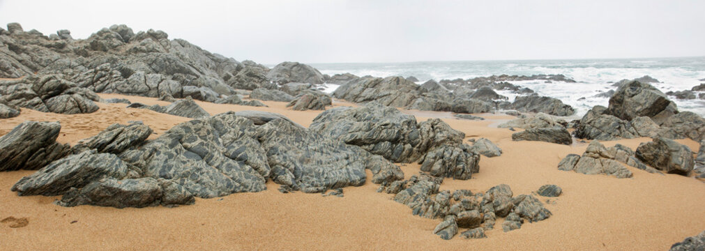 gray stones on the beach in Isla Negra