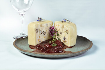mozzarella cheese with cream cheese filling and chestnuts, hazelnuts and red fruit jam