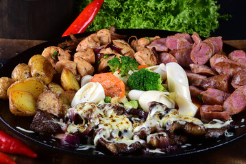 roast beef with pork sausage, roasted potatoes and salad