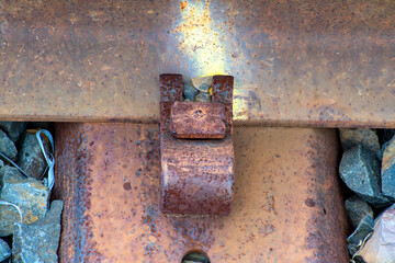Close-up of railroad tie holding track to sleepers on an old railway line