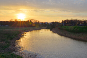 Fototapeta na wymiar Dawn on the bank of the Kamenka River