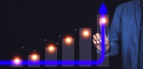 Businessman pointing on arrow graph chart, corporate growth planning for business development to success and growing growth concept