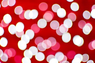 Background image with red and white bokeh lights.