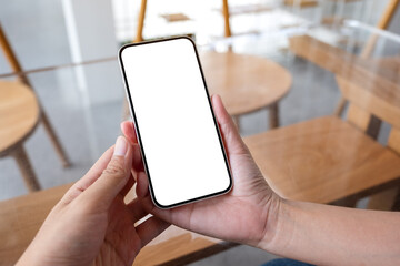 Mockup image of a couple people holding and looking at the same mobile phone with blank desktop screen