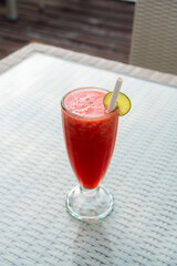 A glass of fresh watermelon juice on the table