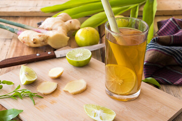 herbal drinks lemon, ginger for health care arrangement flat lay style on wooden