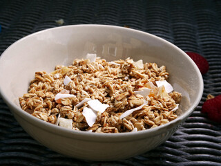 Granola cereal for breakfast in a bowl medium shot