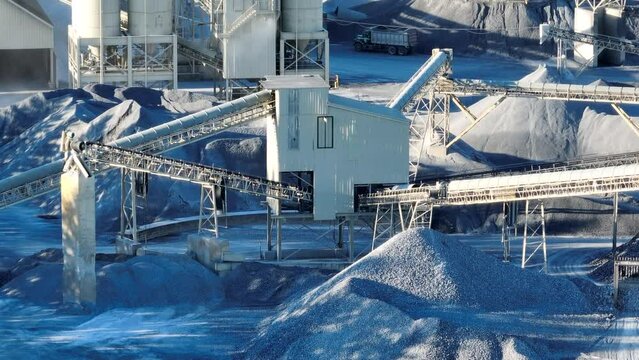 Limestone mine quarry. Elevator system transports rocks into piles for construction projects. Aerial view.