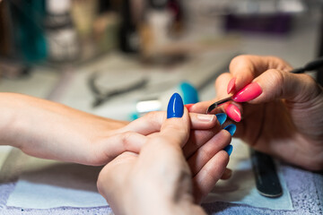 women's manicure in a beauty salon close-up
