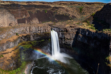 powerful and beautiful Palouse Falls dropping its powerful water in a basin  in Snake River along a canyon in east Washington.