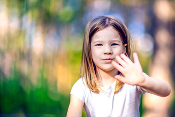 Happy little girl outdoors close up portrait