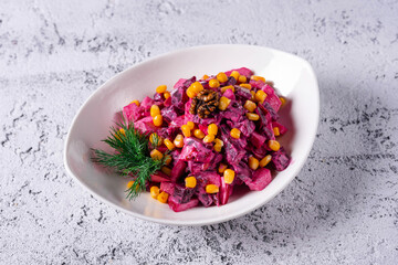 Vinaigrette, red beet salad, corn. on a light concrete background