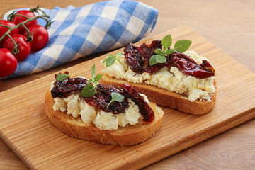 Bruschetta with soft cheese and tomato