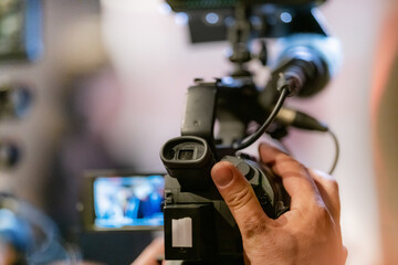 Television camera at an evening press conference