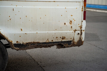 Rust on the body of an old minibus