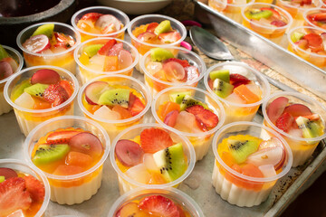 Cup filled with fresh fruits.