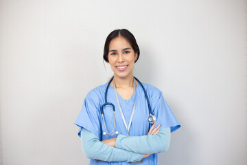 Portrait of young asian nurse in the white room, healthcare workers concept.