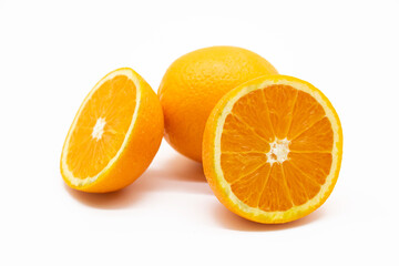 whole and slices orange isolated on white background