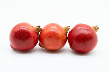 whole pomegranate isolated on white background