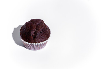 Chocolate cupcake in paper wrapper