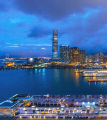 Fototapeta na wymiar Amazing night of Victoria Harbour and Sky100 area, Hong Kong, at evening time