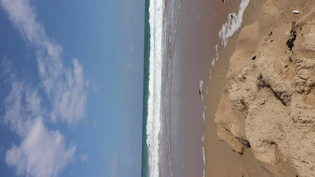 The beach of Atlit - Israel. White sands against the backdrop of a wavy sea
