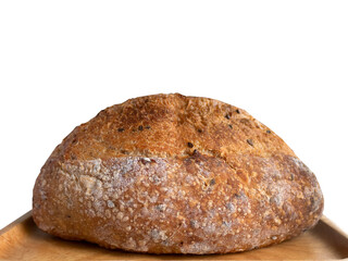 Side view of baked brown homemade sourdough on the wooden plate, isolated, plain background with copy space and clipping path