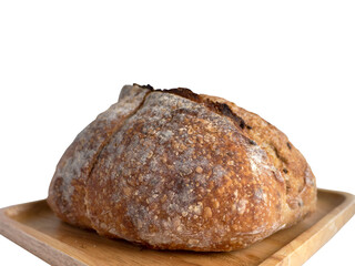 Side view of baked brown homemade sourdough on the wooden plate, isolated, plain background with copy space and clipping path