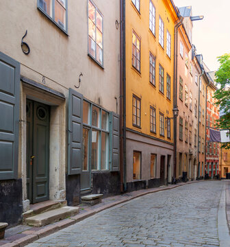 Narrow alley located in Gamla stan, the old town of Stockholm, Sweden with old style colorful houses and cobblestone street