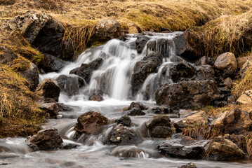 Close-up of a picturesque stream in Reykjadalur valley, along a popular hiking trail, near...