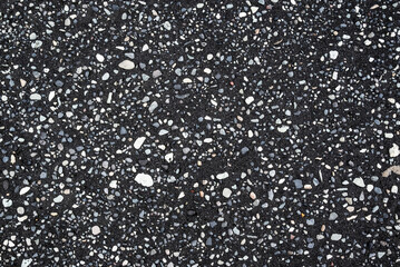 Natural background texture of pebbles, small stones and black sand, Diamond Beach, Iceland