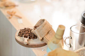 Closeup of Lots of coffee beans on the logs, with sacks of coffee beans placed inside a coffee shop cafe in Thailand.