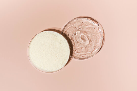 Samples Of Collagen Powder And Hyaluronic Acid In Petri Dishes On A Pink Background Close-up View From Above