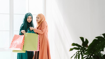 Islamic women friends shopping together on the weekend.