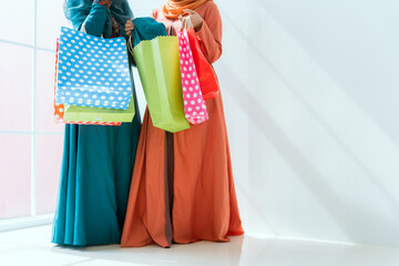Fototapeta premium Islamic women friends shopping together on the weekend.
