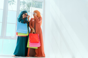 Islamic women friends shopping together on the weekend.