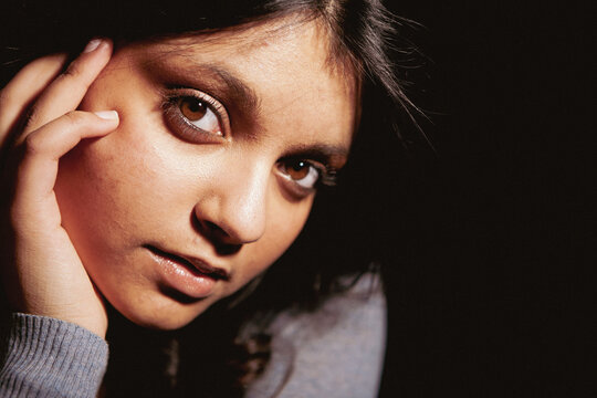 Brown Eyed Look. An interested look from a beautiful young mixed race Anglo-Indian female model. From a series of images with the same model.