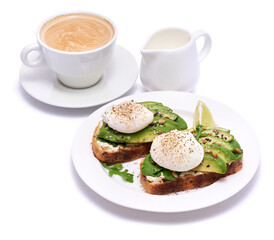 Freshly made poached egg and Avocado toasts isolated on white background