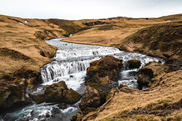 Panoramic view of the beautiful, funnel-like Hestavaðsfoss waterfall, Laugavegur hiking trail, Iceland