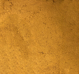 Brown ground coffee background. Ground coffee in close-up. Aromatic ground coffee in close-up