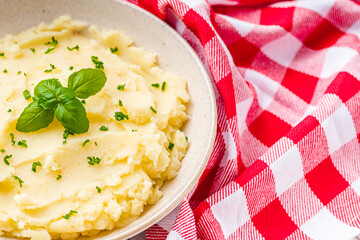 fresh tasty mashed potatoes on a white wooden rustic background